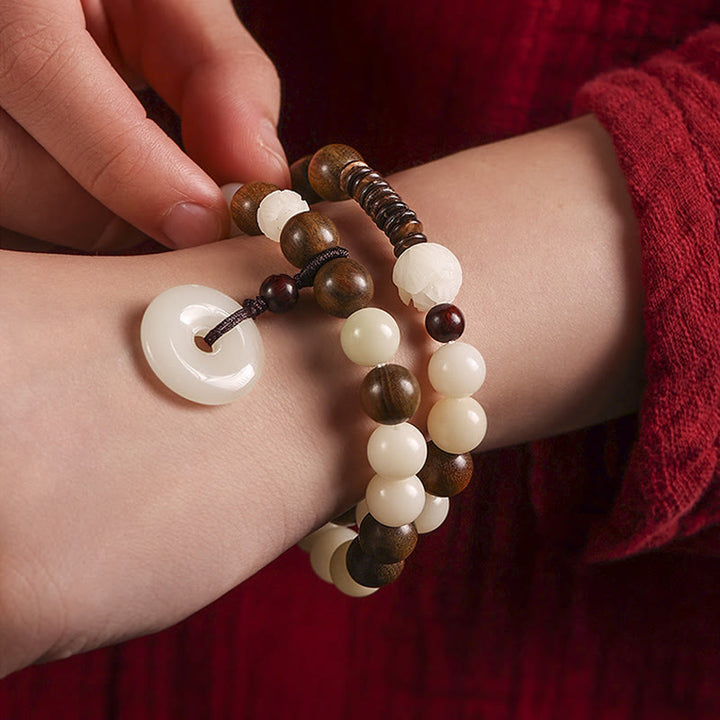 Buddha Stonesの種 グリーンサンダルウッド 蓮の平和のお守りチャームハーモニー ダブルラップブレスレット