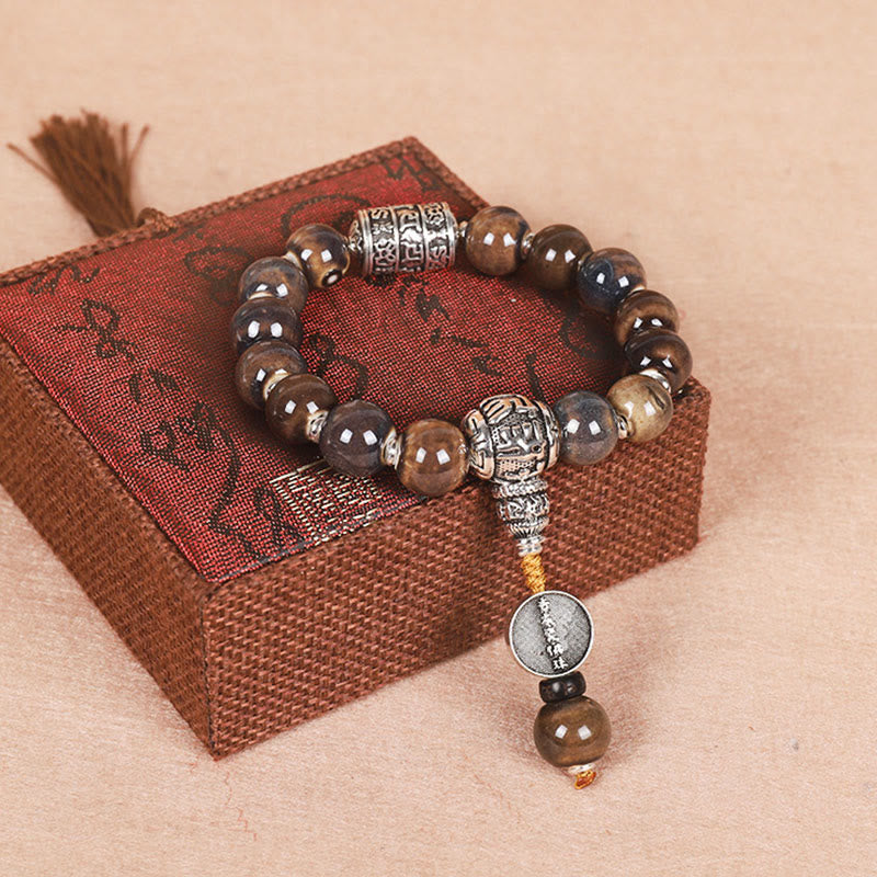 チベットのBuddha Stones、オーム・マニ・パドメ・フムの祈祷ホイール、ドルジェ・ヴァジュラの彫刻入りガラスビーズの知恵のブレスレット