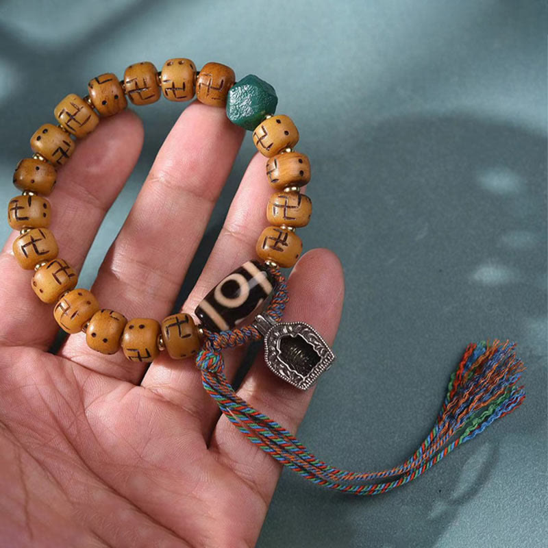 Buddha Stones天然チベットラクダ骨卍 Dzi ビーズ Shankha 仏陀チャーム Kirtimukha 幸運保護タッセルブレスレット
