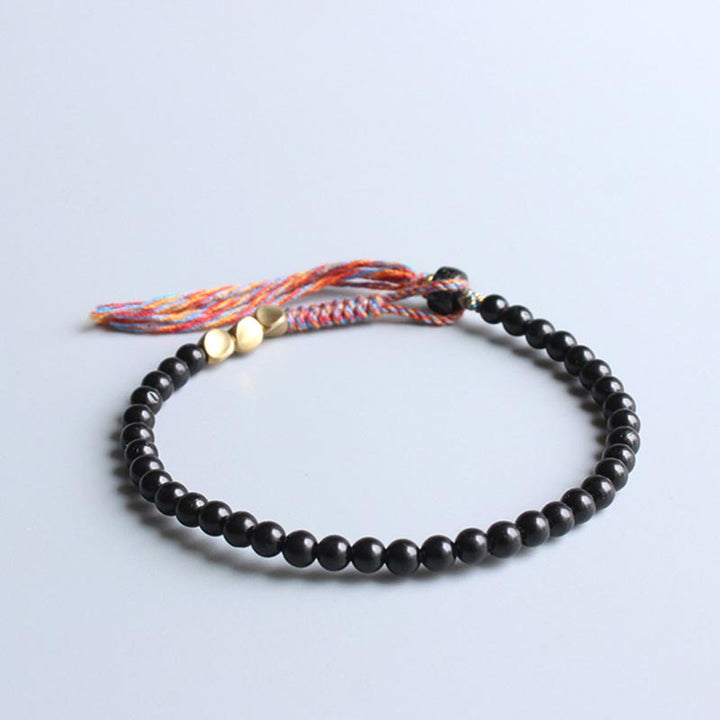 Buddha Stonesハンドメイドチベットブラックオニキスタッセルブレスレット