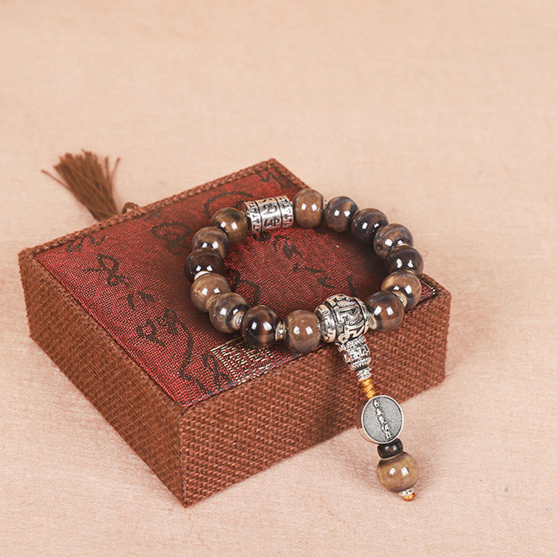 チベットのBuddha Stones、オーム・マニ・パドメ・フムの祈祷ホイール、ドルジェ・ヴァジュラの彫刻入りガラスビーズの知恵のブレスレット