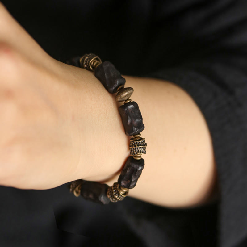 Buddha Stonesチベット黒檀 銅 穏やかで平和なブレスレット