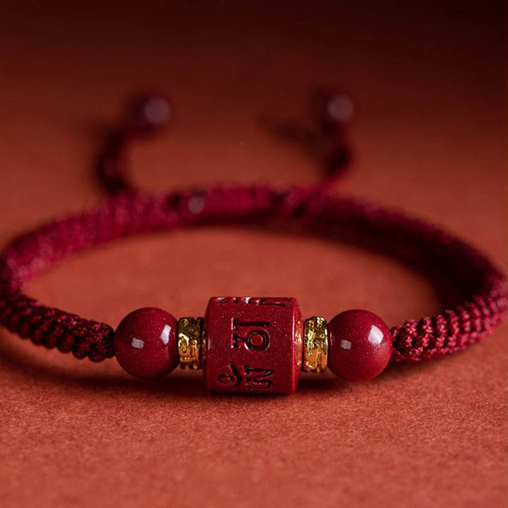 Buddha Stonesチベット 辰砂オーム・マニ・パドメ・フム刻印入り 祝福 編み込み ブレスレット