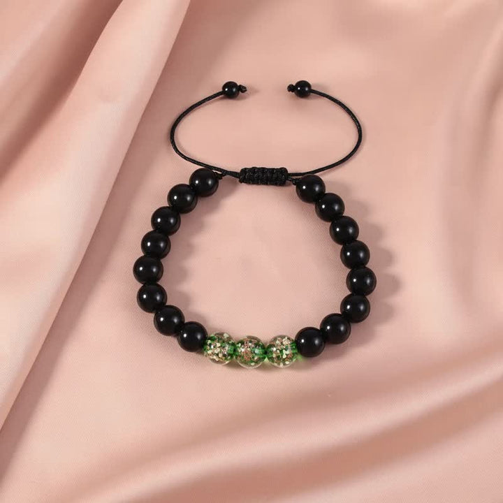 Buddha Stonesブラックオブシディアン 光るグロウストーン 強さのブレスレット