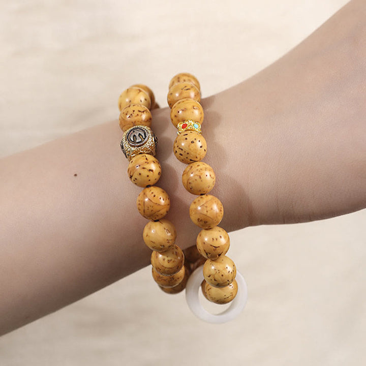 Buddha Stonesチベット天然紫金鼠菩提樹の富ダブルラップブレスレット