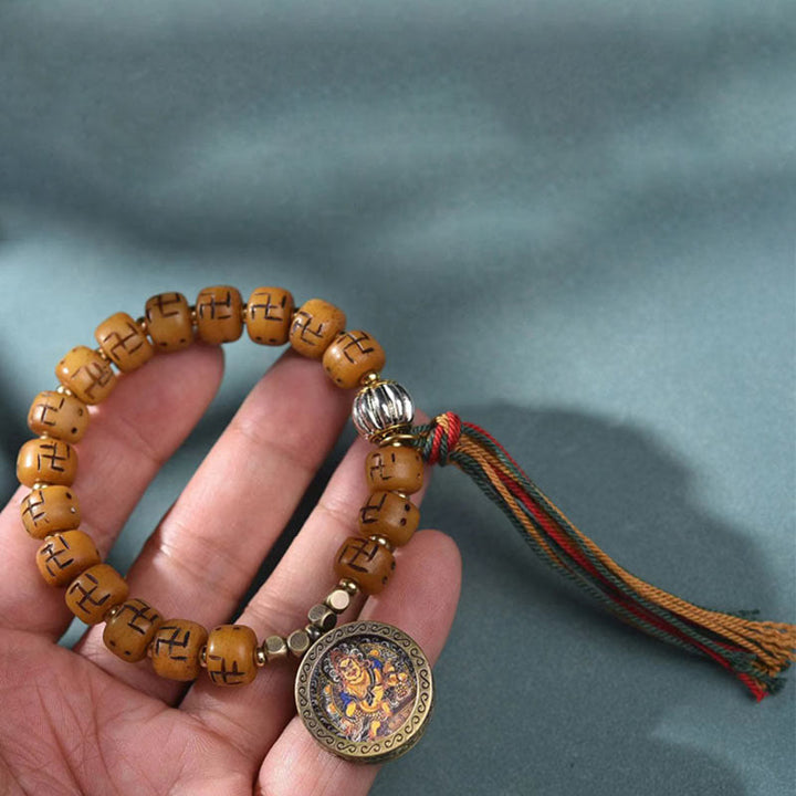 Buddha Stones天然チベットラクダ骨卍 Dzi ビーズ Shankha 仏陀チャーム Kirtimukha 幸運保護タッセルブレスレット