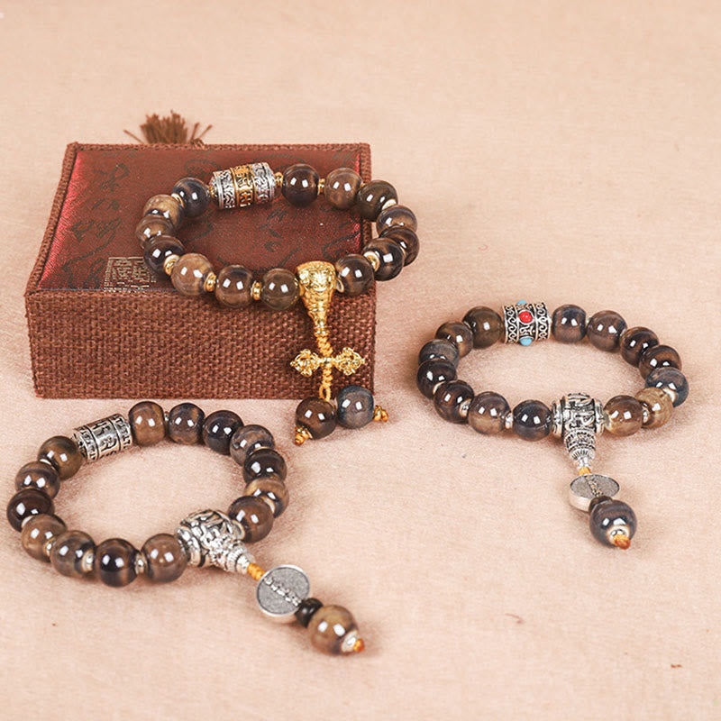 チベットのBuddha Stones、オーム・マニ・パドメ・フムの祈祷ホイール、ドルジェ・ヴァジュラの彫刻入りガラスビーズの知恵のブレスレット