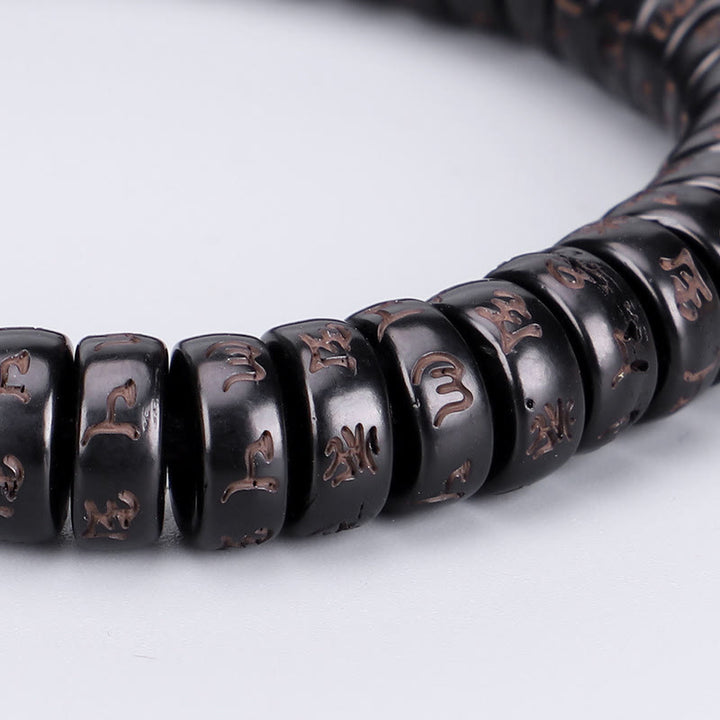 Buddha Stonesチベットココナッツシェルビーズ 彫刻入りオーム・マニ・パドメ・フムマントラ ポジティブストリングブレスレット