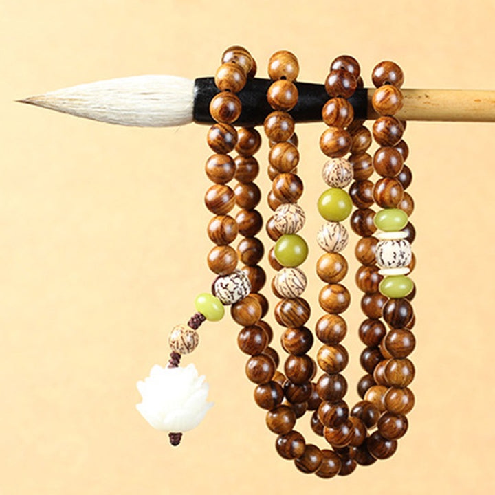 Buddha Stonesチベットローズウッド蓮のMala保護鎮静ネックレスブレスレット